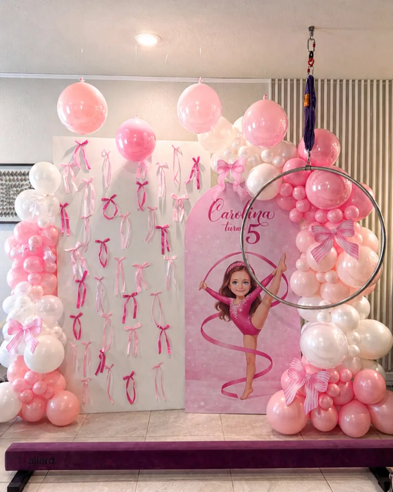 Gymnastics themed birthday with a printed panel, ribbon wall and aerial hoop